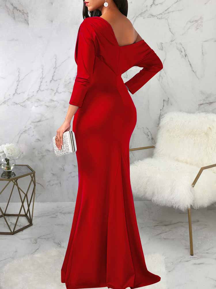 back view of a woman in a red one-shoulder draped long sleeve mermaid formal gown