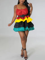 Front view of a woman wearing a tiered color-block mini dress with a belt.