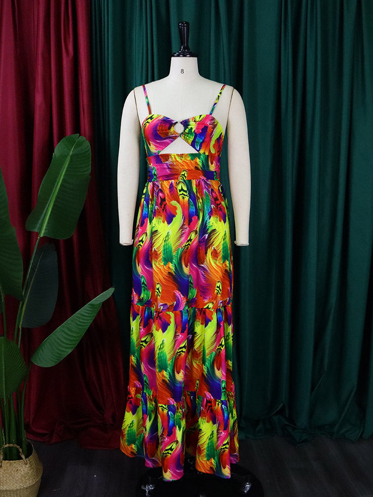 Woman posing outdoors in a brightly colored, patterned maxi dress with a twisted bust detail