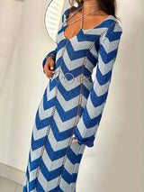 Woman wearing a blue and silver chevron knit maxi dress with a belt