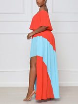 Side view of a woman wearing an off-the-shoulder, colorblock maxi dress.