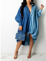 Woman wearing a two-tone blue oversized shirt dress with button-down front and adjustable drawstring hem, holding a studded handbag.