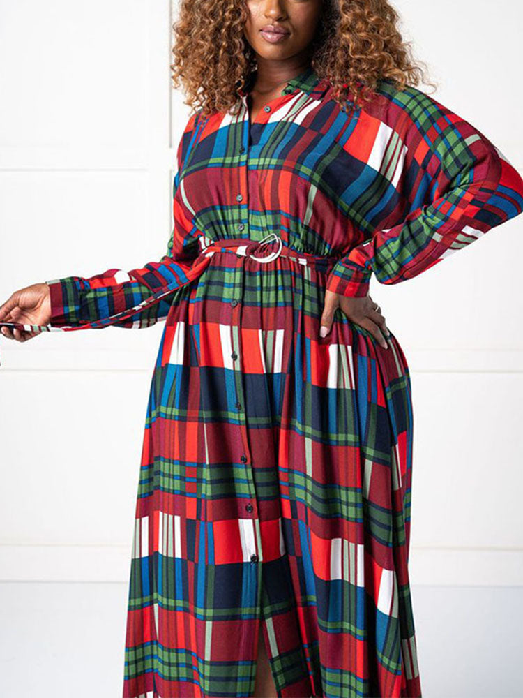 Woman wearing a belted plaid maxi dress with long sleeves