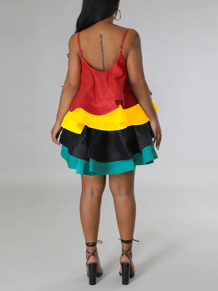 Rear view of a woman in a sleeveless tiered dress with spaghetti straps.