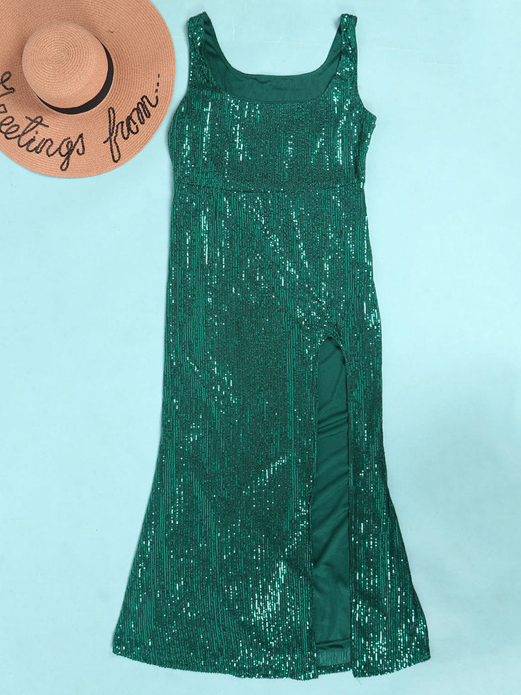 Green sequined dress with a high slit laid flat next to a straw hat