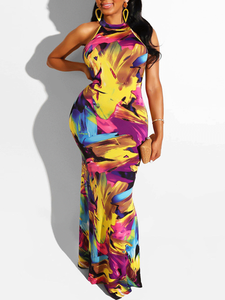 Woman wearing a colorful abstract print halter maxi dress.