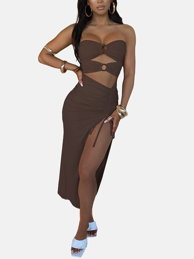 Woman in a brown strapless top and high slit skirt with ring accents