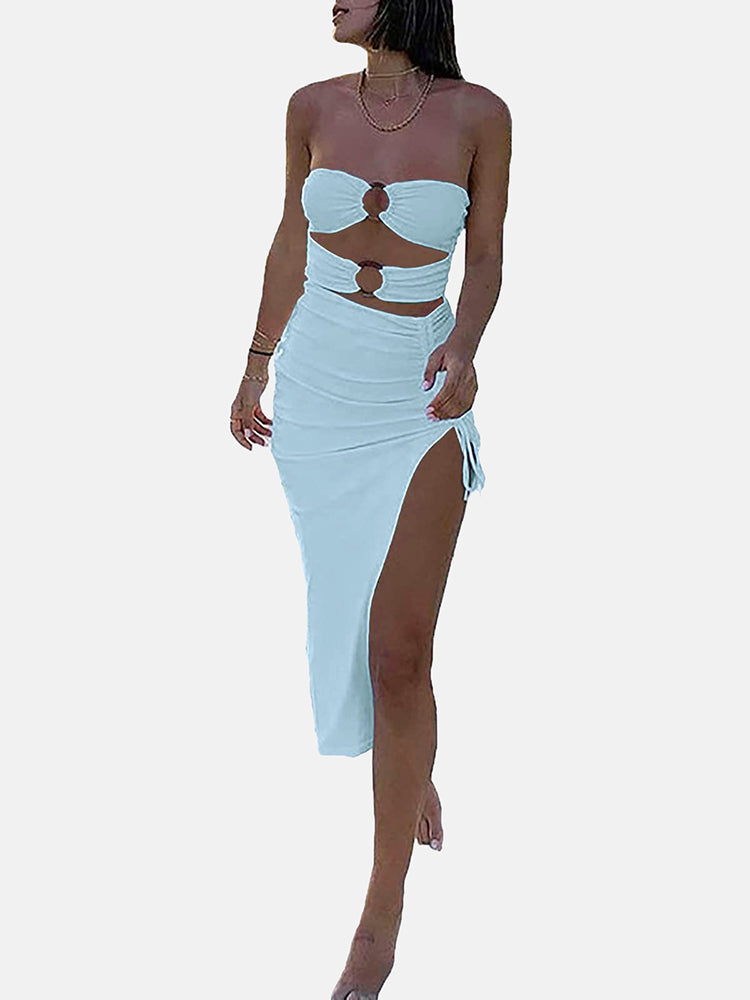 Woman in a light blue strapless two-piece set with a high slit skirt