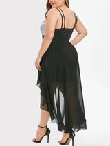 Back view of a plus-size model wearing a black and silver sequined high-low dress with a chiffon overlay.