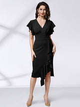 full body shot of a woman in a black sheath dress with ruffle detail