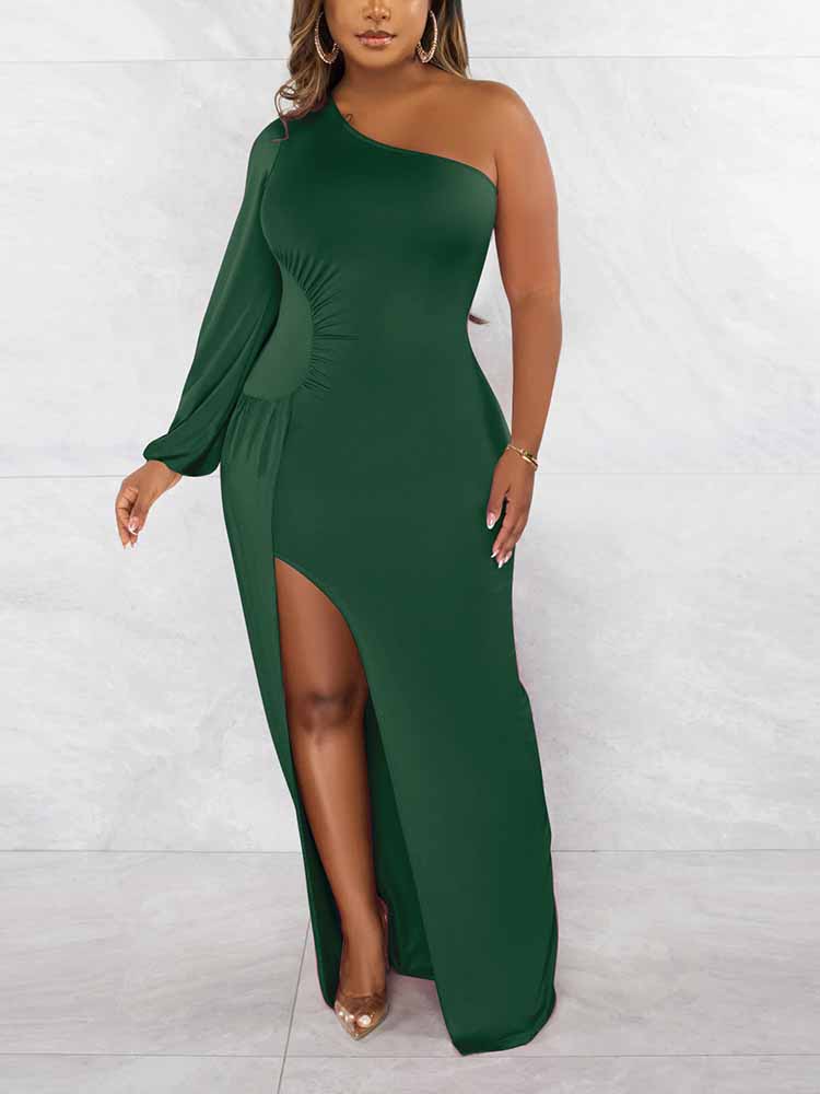 Close-up of the dark green one-shoulder maxi dress, showcasing the fabric and silhouette.