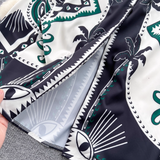 Detail of the hem of the bohemian print maxi dress, showing the intricate pattern and fabric texture.