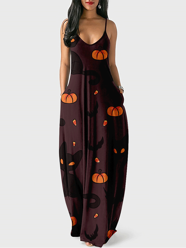 Woman wearing a dark brown maxi dress with a Halloween print featuring black cats and pumpkins.
