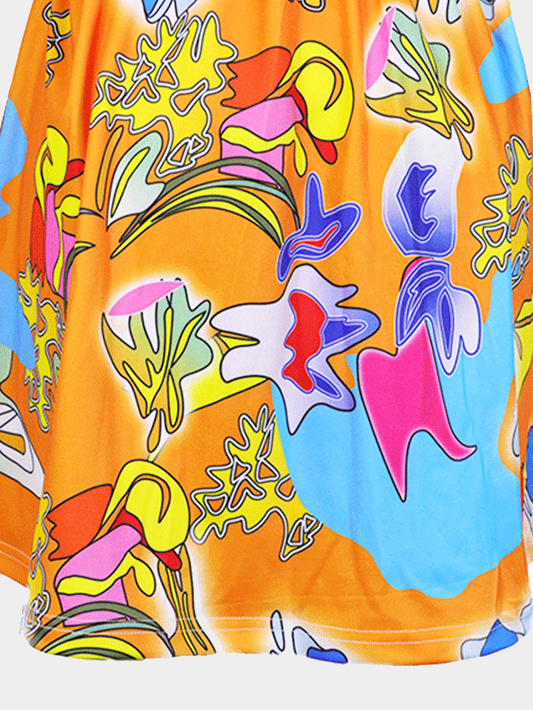 Detail of the colorful abstract print on the skirt of the off-the-shoulder dress