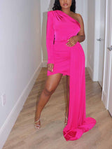 woman in a hot pink one-shoulder mini dress with a long draped train and high heels