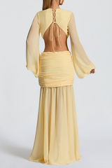 Back view of a yellow dress with an open back secured by a lace-up tie, long balloon sleeves, and a ruched skirt.