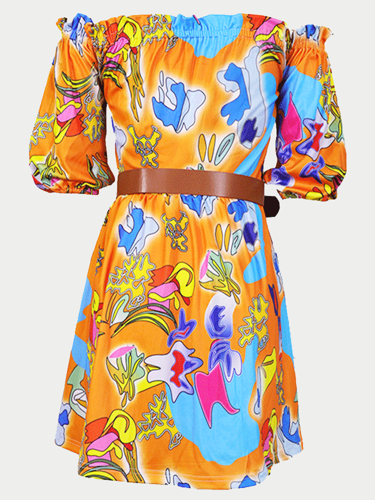 Close-up of the abstract print on the orange off-the-shoulder dress