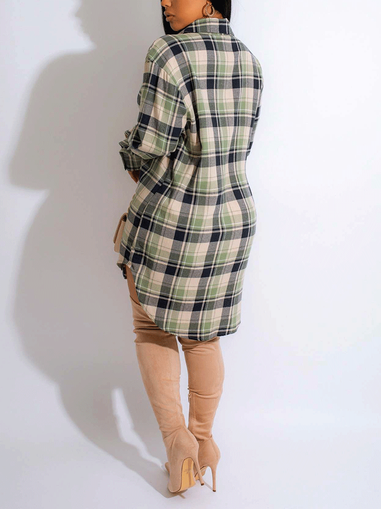 Back view of a woman wearing a green and black plaid shirt dress with thigh-high boots.