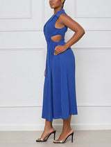 side view of a woman wearing a royal blue sleeveless midi dress with cut-out sides and a collared v-neckline