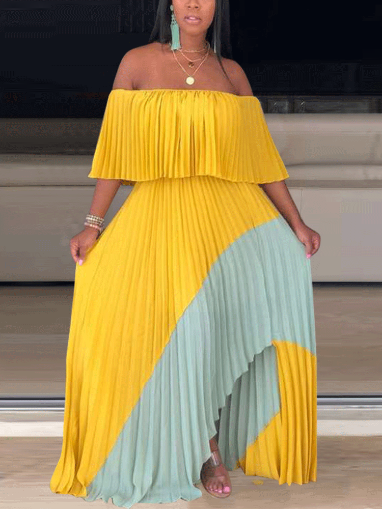 Woman in a yellow and mint green color-block pleated maxi dress