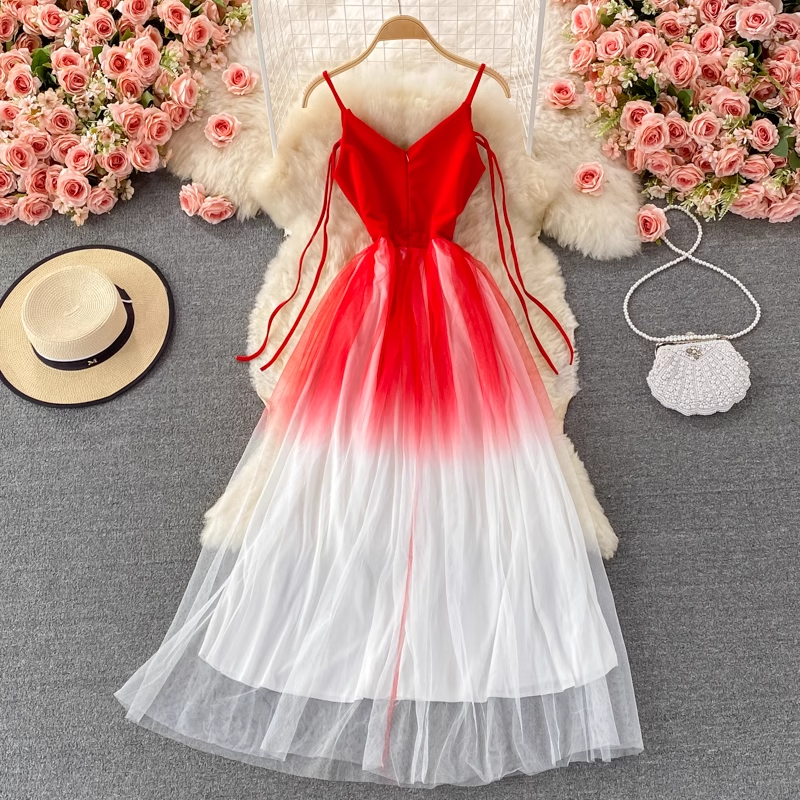 Full view of a red and white gradient tulle dress with spaghetti straps