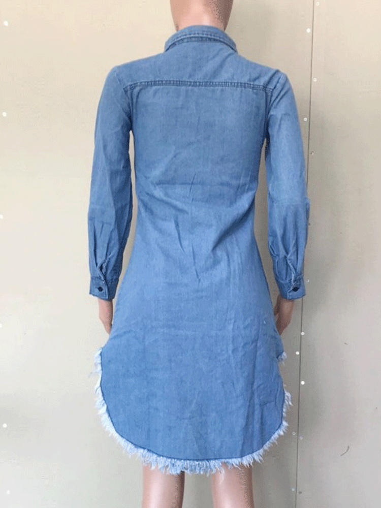 Back view of a mannequin displaying a distressed denim shirt dress with raw hem