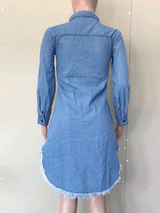 Back view of a mannequin displaying a distressed denim shirt dress with raw hem