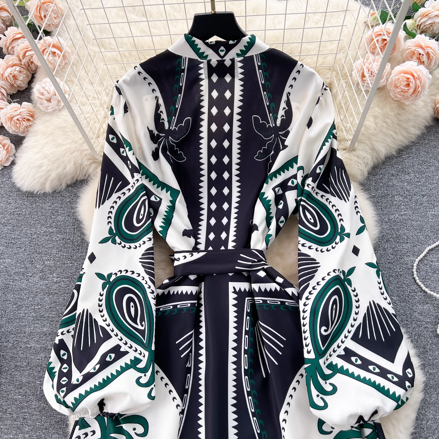 Close-up of the top portion of the bohemian print maxi dress, highlighting the high neckline and balloon sleeves.
