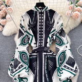 Close-up of the top portion of the bohemian print maxi dress, highlighting the high neckline and balloon sleeves.