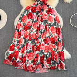 Full view of the floral print maxi dress, showcasing its flowy skirt and slit.