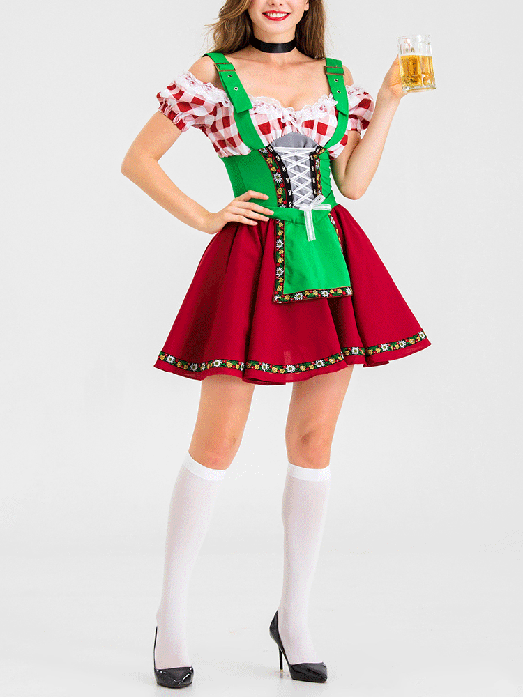 Full-body shot of a woman in a German-inspired costume, showcasing the red skirt and green bodice.