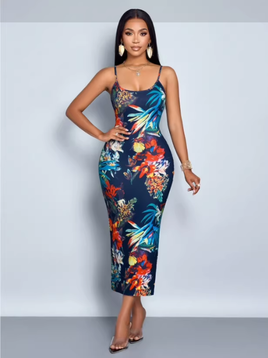 Woman in a floral print bodycon dress with spaghetti straps, standing with one hand on her hip.