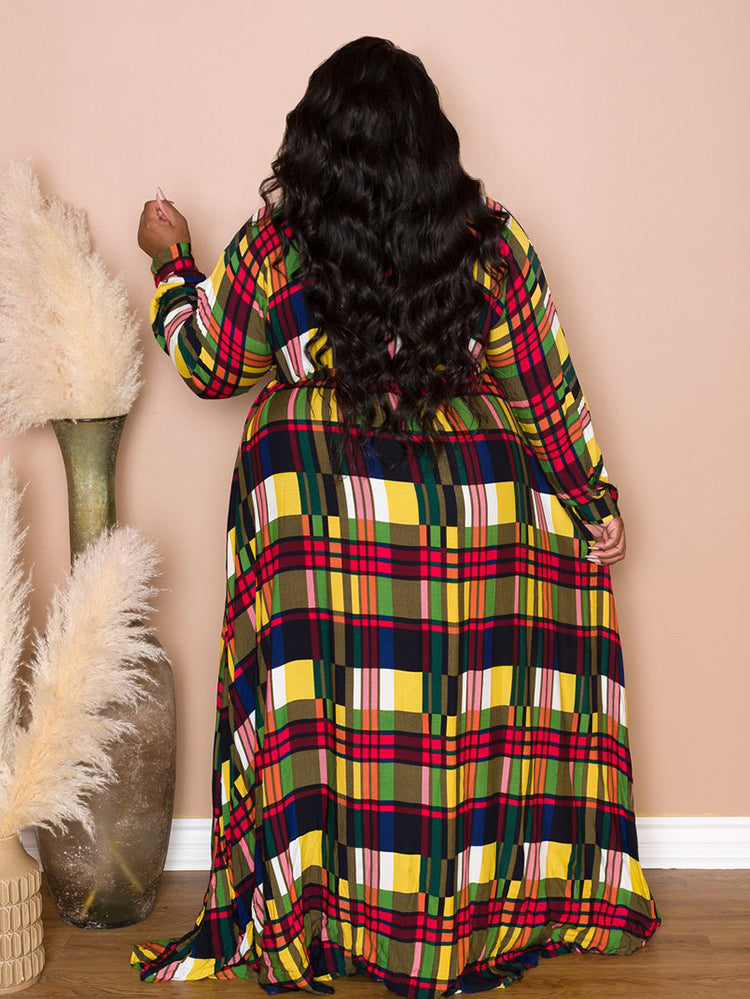 Back view of a woman in a colorful plaid maxi dress