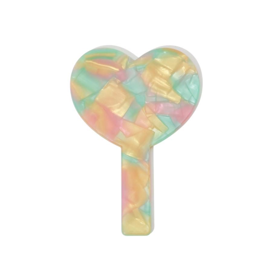 Close-up of the marbled multicolor acetate pattern on the heart-shaped mirror frame