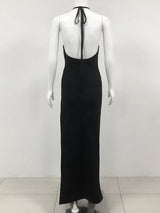 back view of a black floor-length halter dress with an open back and halter straps displayed on a mannequin