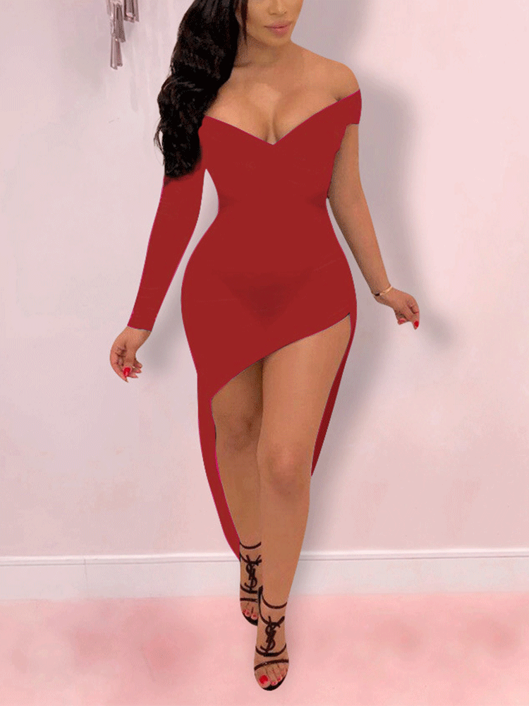Woman wearing a red off-the-shoulder, one-sleeve velvet dress with an asymmetrical hem and high slit.