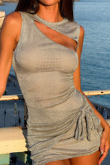 model wearing a silver metallic knit asymmetrical neckline mini dress with a cut-out detail and ruched skirt