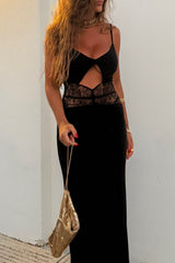 Close-up of a woman in a black evening gown, showcasing the lace panel