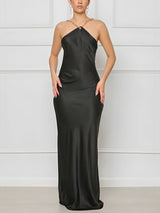 woman wearing a black satin halter dress with a low open back