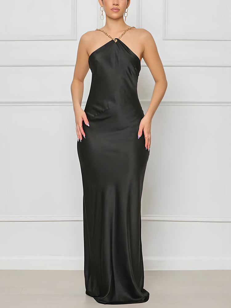 woman wearing a black satin halter dress with a low open back