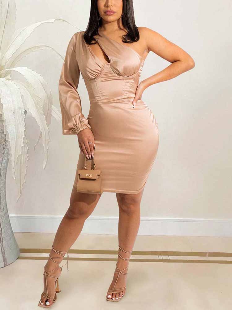Woman wearing a one-shoulder satin mini dress in a champagne hue