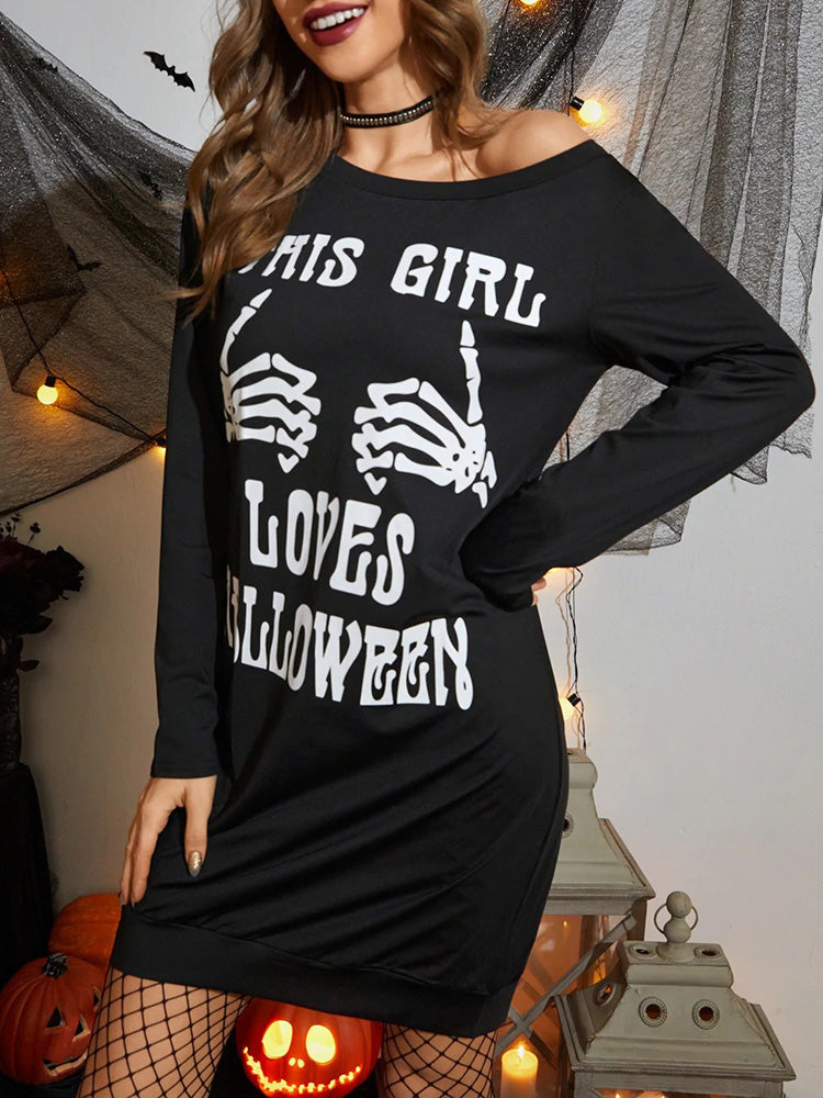 Close-up of the 'THIS GIRL LOVES HALLOWEEN' graphic on a black long-sleeved dress.
