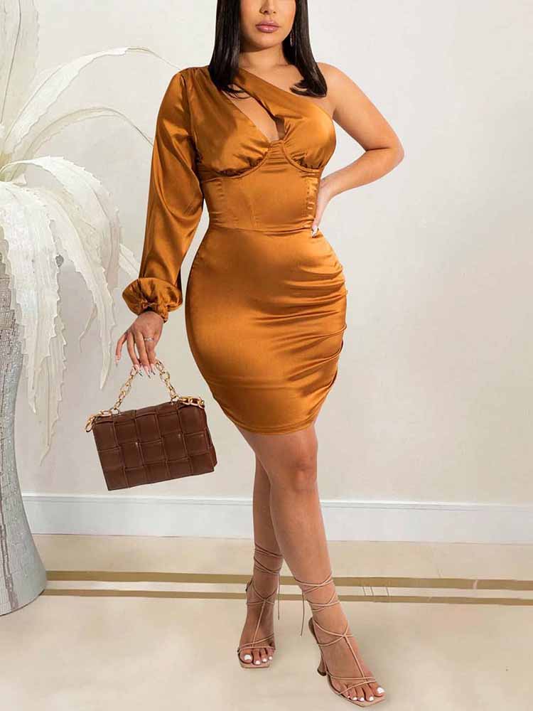 Woman wearing a one-shoulder satin mini dress in a bronze hue