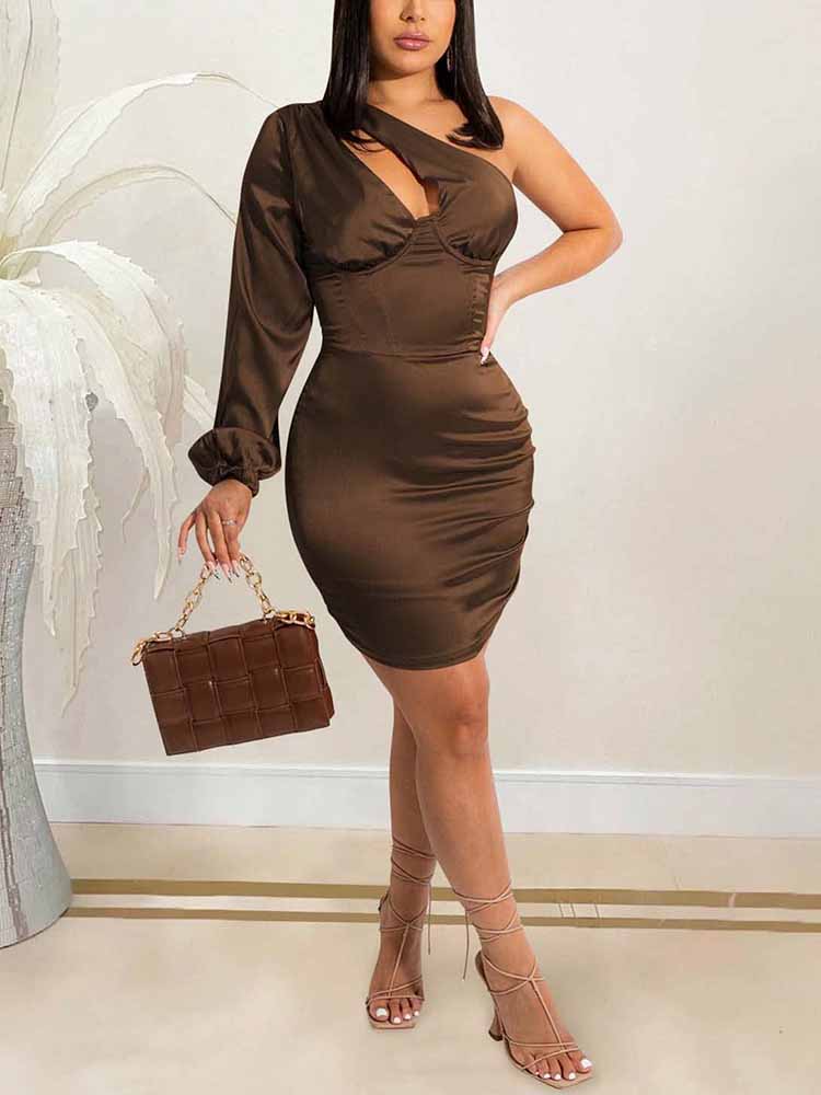 Woman wearing a one-shoulder satin mini dress in a chocolate brown hue