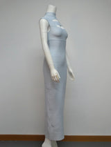 Side view of a light blue sleeveless bodycon maxi dress with cut-out detail at the bust and high neckline displayed on a mannequin against a white background.