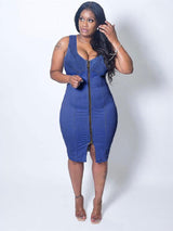Woman wearing a blue denim midi dress with a full front zipper closure and a scoop neckline.
