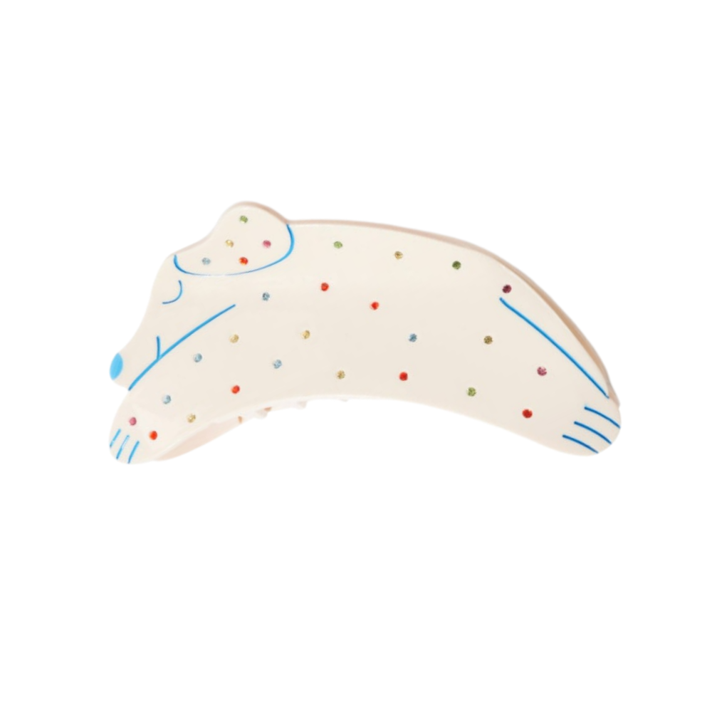 Cream dog-shaped hair claw with colorful polka dots and blue line details, shown from the side.