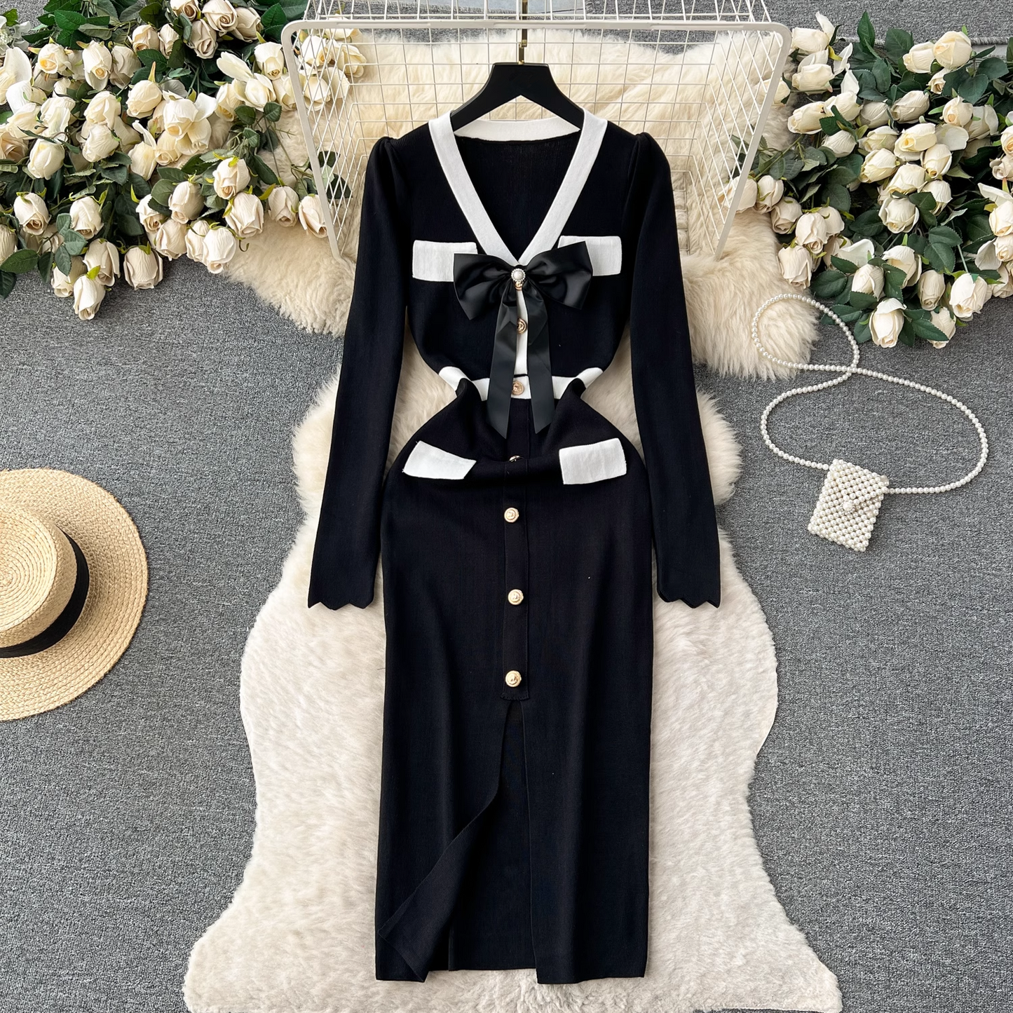 Black knit dress with white trim and bow detail