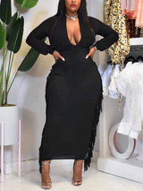 woman wearing a black long-sleeved bodycon maxi dress with fringe trim and a plunging neckline
