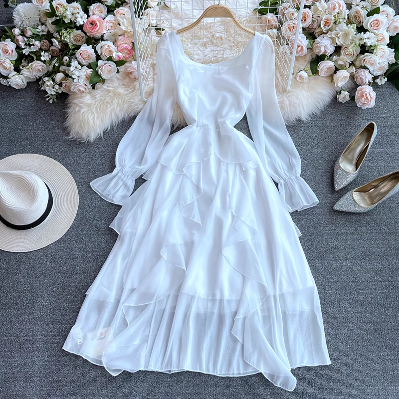 White tiered ruffled chiffon dress with bell sleeves